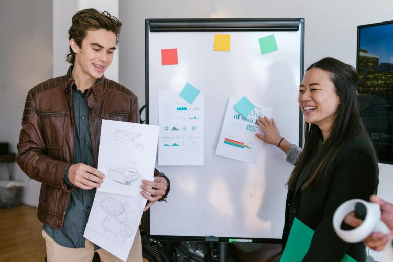 Young professionals collaborating on business ideas and presentation development.